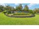 A stone monument announces the Laurel Wood community, surrounded by a lush green lawn at 2908 Se 22Nd Ave, Ocala, FL 34471