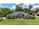 Charming single-story home with a well-manicured front lawn and mature landscaping, creating a welcoming curb appeal at 2908 Se 22Nd Ave, Ocala, FL 34471
