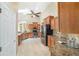 Open kitchen with granite countertops, stainless steel appliances, and custom cabinets at 2908 Se 22Nd Ave, Ocala, FL 34471