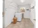 Bright laundry room with washer, dryer and shelving, offering ample storage and convenience at 2908 Se 22Nd Ave, Ocala, FL 34471