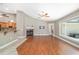 Living room featuring a fireplace, wood floors, and a large window with lots of light at 2908 Se 22Nd Ave, Ocala, FL 34471