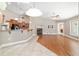 Open-concept living area with a fireplace, breakfast bar, and hardwood floors, perfect for entertaining at 2908 Se 22Nd Ave, Ocala, FL 34471