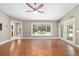 Bright living room with hardwood floors and access to the outdoor area and pool at 2908 Se 22Nd Ave, Ocala, FL 34471