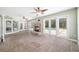 Bright living area featuring a stone fireplace and seamless access to the outdoor pool area at 2908 Se 22Nd Ave, Ocala, FL 34471