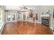Inviting living room with hardwood floors, a fireplace, and access to the outdoor patio at 2908 Se 22Nd Ave, Ocala, FL 34471