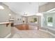 Bright and airy living room featuring hardwood floors, fireplace, and sliding glass doors to the pool at 2908 Se 22Nd Ave, Ocala, FL 34471