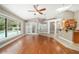 Light-filled living room with hardwood floors, access to the pool, and an open layout at 2908 Se 22Nd Ave, Ocala, FL 34471