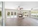 Spacious living room with fireplace and multiple access points to the pool at 2908 Se 22Nd Ave, Ocala, FL 34471