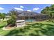Inviting screened-in pool with an adjacent storage and clear views of the outdoor living space at 2908 Se 22Nd Ave, Ocala, FL 34471