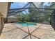 A lovely pool with brick pavers and screened enclosure, perfect for a relaxing swim at 2908 Se 22Nd Ave, Ocala, FL 34471