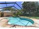 A stunning pool with attached hot tub, screened enclosure, and brick pavers create a luxurious backyard retreat at 2908 Se 22Nd Ave, Ocala, FL 34471