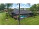 Gorgeous screened-in pool with brick patio and well-maintained landscaping at 2908 Se 22Nd Ave, Ocala, FL 34471