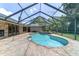 A luxurious pool with brick pavers and screened-in enclosure create a backyard oasis at 2908 Se 22Nd Ave, Ocala, FL 34471