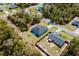 Aerial view of a neighborhood with well-maintained lawns, wooded areas and multiple homes at 3325 Sw 165Th Loop, Ocala, FL 34473