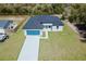 Aerial view of a single-Gathering home showcasing a well-manicured lawn and attached garage at 3325 Sw 165Th Loop, Ocala, FL 34473