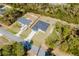 Aerial view of single-Gathering homes, showcasing a wooded lot and neighborhood street at 3325 Sw 165Th Loop, Ocala, FL 34473