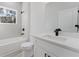 Bright bathroom featuring a tub, black fixtures, and a modern vanity with white countertop and cabinets at 3325 Sw 165Th Loop, Ocala, FL 34473
