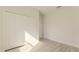 A bedroom features modern flooring, a window with natural light, and a closet for storage at 3325 Sw 165Th Loop, Ocala, FL 34473