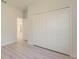 Large closet with bi-fold doors offers ample storage space, set against neutral walls and light flooring at 3325 Sw 165Th Loop, Ocala, FL 34473