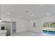 Bright living room with stainless steel fridge, sliding glass door and window for natural light at 3325 Sw 165Th Loop, Ocala, FL 34473