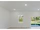 Bright, airy living room with large window and sliding glass door providing ample natural light at 3325 Sw 165Th Loop, Ocala, FL 34473