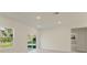 Bright, airy living room with large window and sliding glass door providing ample natural light at 3325 Sw 165Th Loop, Ocala, FL 34473