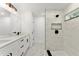 Modern bathroom with double vanity, walk-in shower, and sleek black hardware at 36 Pine Radl, Ocala, FL 34472