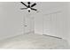 Bright bedroom features tile floors, a ceiling fan, and a closet at 36 Pine Radl, Ocala, FL 34472
