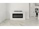 Cozy living room showing a fireplace and marble floors at 36 Pine Radl, Ocala, FL 34472