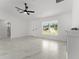 Spacious living room featuring marble flooring and a large window for natural light at 36 Pine Radl, Ocala, FL 34472