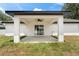 Covered patio with ceiling fan overlooking the backyard at 36 Pine Radl, Ocala, FL 34472