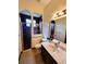 Modern bathroom featuring a glass shower, tile flooring, and a marble countertop vanity at 3803 Se 6Th Ave, Ocala, FL 34480