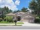 Charming single-story home with neutral stucco, arched entryway, two-car garage, and well-maintained landscaping at 3803 Se 6Th Ave, Ocala, FL 34480
