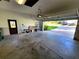 Spacious garage with an automatic door, side door, and ample space for parking and storage at 3803 Se 6Th Ave, Ocala, FL 34480