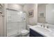 Bright bathroom featuring a shower with glass doors and modern vanity with ample counter space at 4474 Nw 53Rd Ave Rd, Ocala, FL 34480