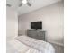 Bright bedroom featuring a large dresser for storage and neutral tones creating a relaxing atmosphere at 4474 Nw 53Rd Ave Rd, Ocala, FL 34480