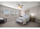Cozy bedroom featuring a queen-sized bed, neutral decor, and natural light from the window at 4474 Nw 53Rd Ave Rd, Ocala, FL 34480