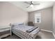 Comfortable bedroom featuring a ceiling fan, neutral walls, and coordinated furnishings at 4474 Nw 53Rd Ave Rd, Ocala, FL 34480