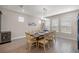 Dining room features a rustic wood table with seating for eight and natural light from multiple windows at 4474 Nw 53Rd Ave Rd, Ocala, FL 34480