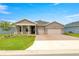 Charming single-story home featuring a well-manicured lawn and a two-car garage at 4474 Nw 53Rd Ave Rd, Ocala, FL 34480