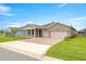 Charming single-story home featuring a well-manicured lawn and a two-car garage at 4474 Nw 53Rd Ave Rd, Ocala, FL 34480