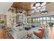 Expansive lounge area boasts a fireplace, soaring ceilings, and stylish decor for upscale comfort at 4474 Nw 53Rd Ave Rd, Ocala, FL 34480