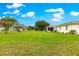 Expansive backyard with lush green grass, well-maintained landscaping, and plenty of space for outdoor activities and relaxation at 6172 Sw 101St Pl, Ocala, FL 34476