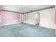 Bedroom with carpeted floors, floral wallpaper border, ceiling fan, and natural light at 6172 Sw 101St Pl, Ocala, FL 34476