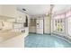 Bright eat-in kitchen with white appliances and lots of cabinet space at 6172 Sw 101St Pl, Ocala, FL 34476