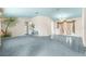 Open-concept living space featuring tiled flooring and a decorative mural, perfect for entertaining guests at 6172 Sw 101St Pl, Ocala, FL 34476