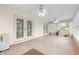 Enclosed sunroom with many windows and sliding glass doors at 6172 Sw 101St Pl, Ocala, FL 34476
