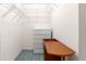 Walk-in closet with metal shelving and a dresser at 6172 Sw 101St Pl, Ocala, FL 34476