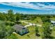 An aerial view of the property showcasing the house, yard, and surrounding landscape at 6773 Se 87Th St, Ocala, FL 34472
