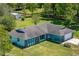 Aerial of charming single-story home with stone accents and expansive green yard at 6773 Se 87Th St, Ocala, FL 34472